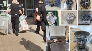 £400,000 in cash, 41 luxury watches and a bust of Winston Churchill seized in dawn raids